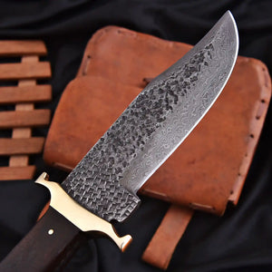 Hand forged Damascus steel Bowie knife close-up