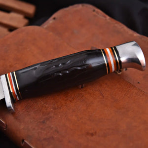 Handmade carbon steel hunting knife with black resin handle