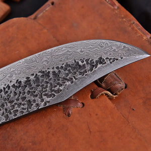 Hand forged Damascus steel Bowie knife close-up