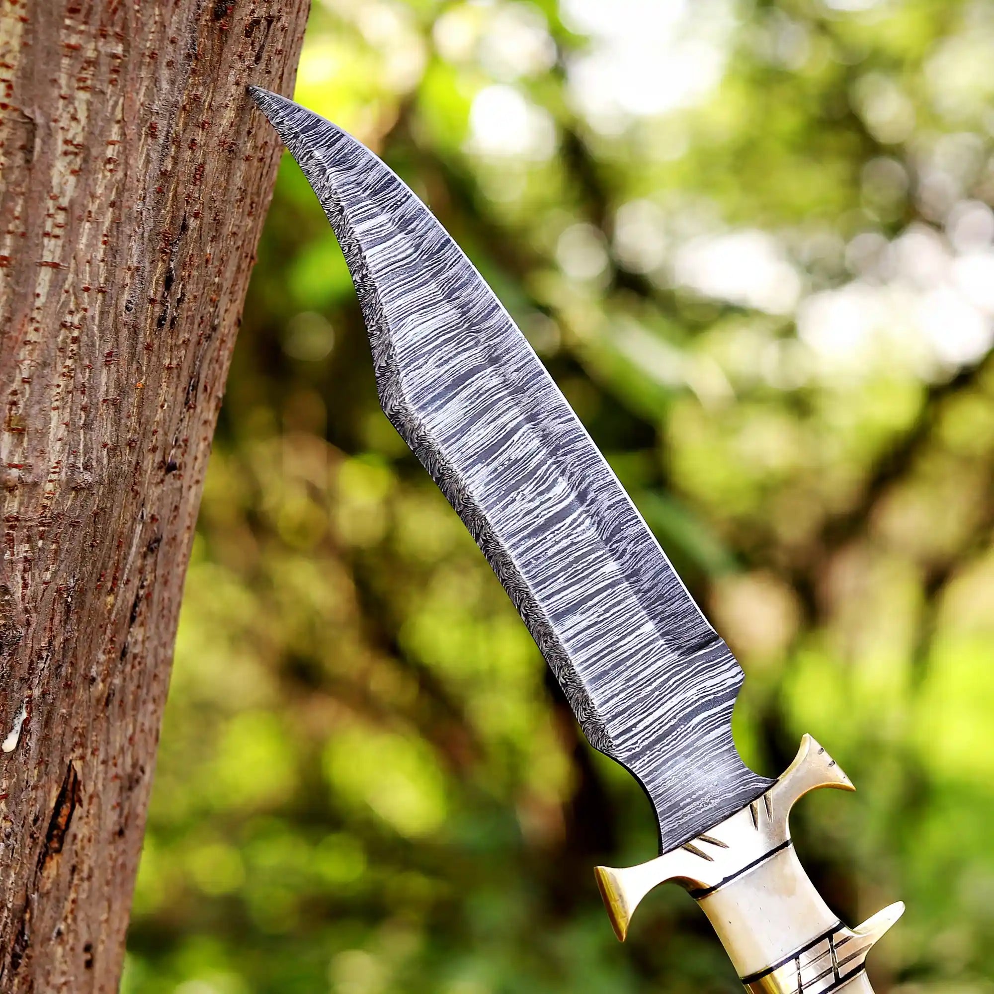 Close-up of Damascus steel pattern and bone handle