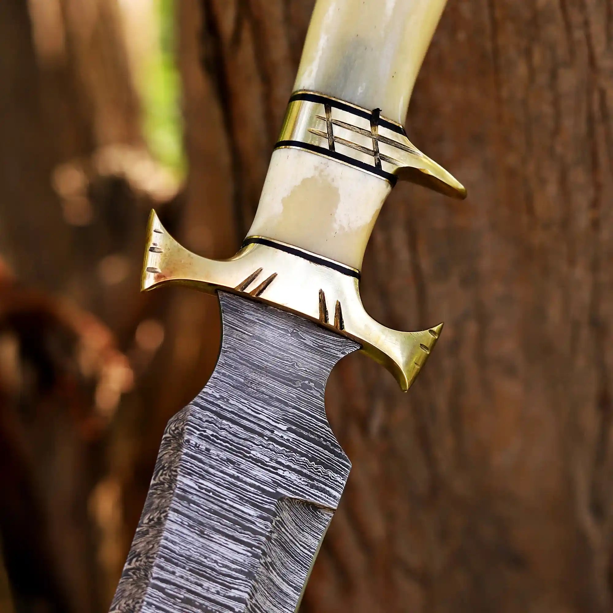 Damascus hunting knife with brass fittings