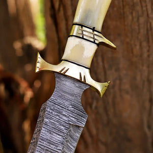Damascus hunting knife with brass fittings