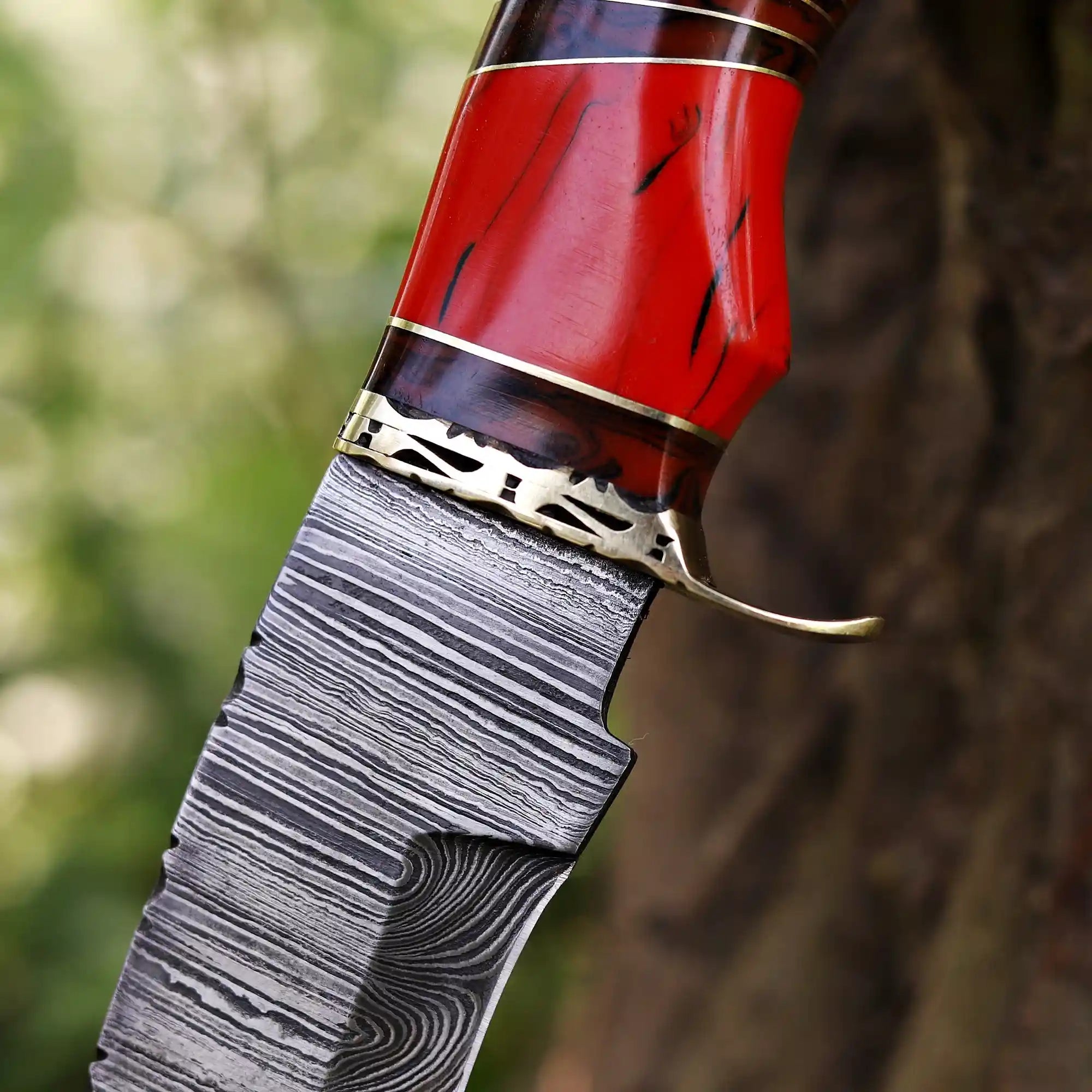 Close-up of Damascus steel blade pattern and resin Handle
