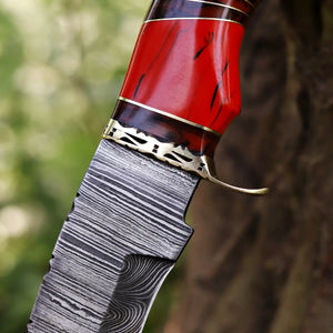 Close-up of Damascus steel blade pattern and resin Handle