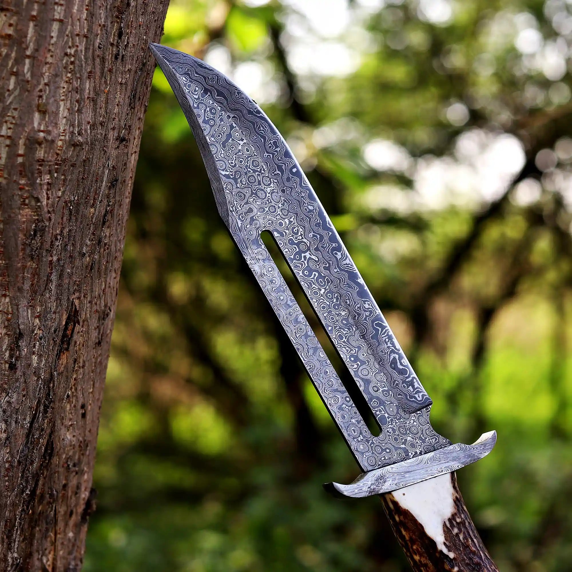 closeup of Damascus raindrop pattern bowie knife