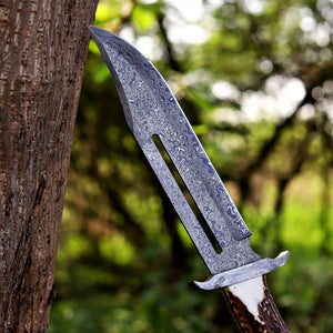 closeup of Damascus raindrop pattern bowie knife