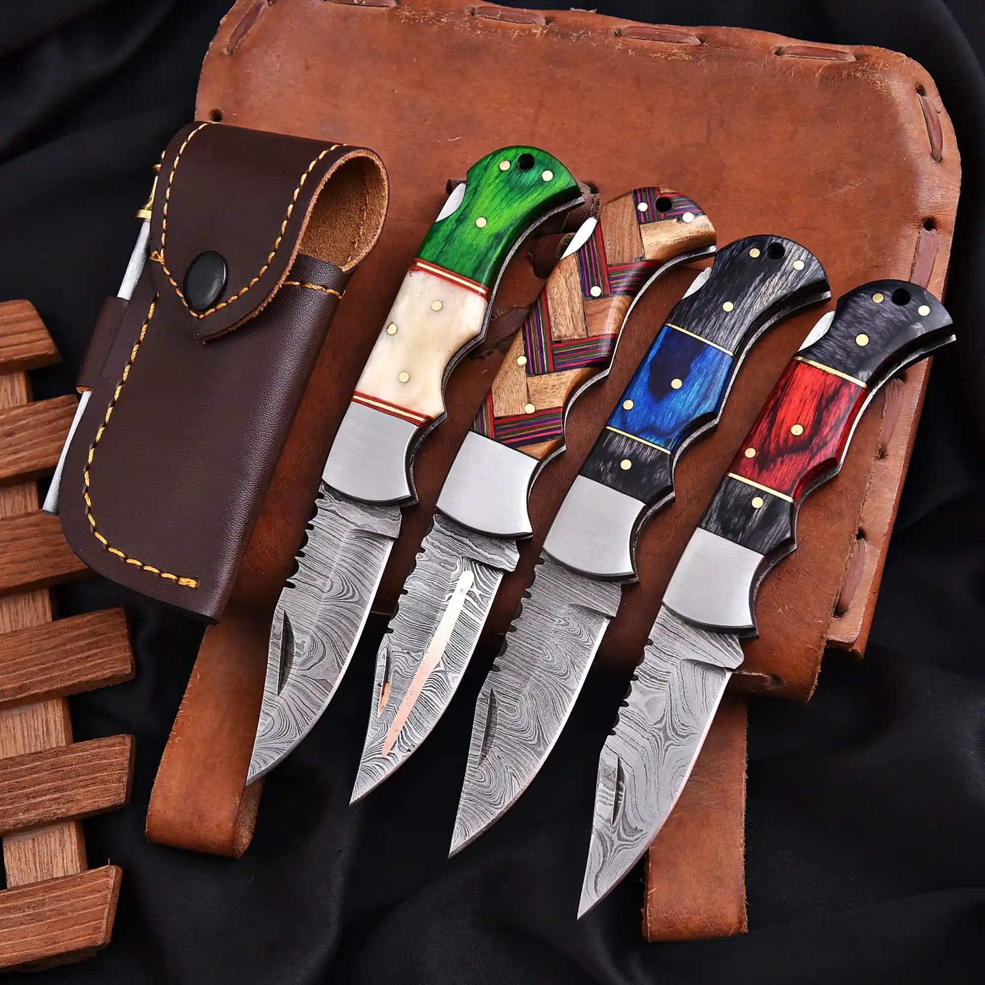 Handmade Damascus steel folding knife with leather sheath